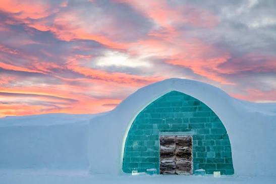 A hall of cut ice and packed snow inside a winter building